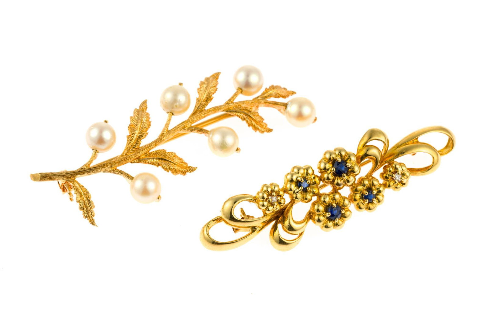 Two 18K Gold Brooches: Two yellow gold brooches 2" in length with floral and tree themes. One with pearls and the second with small diamonds and blue sapphires. The total weight is 12,7 grams.