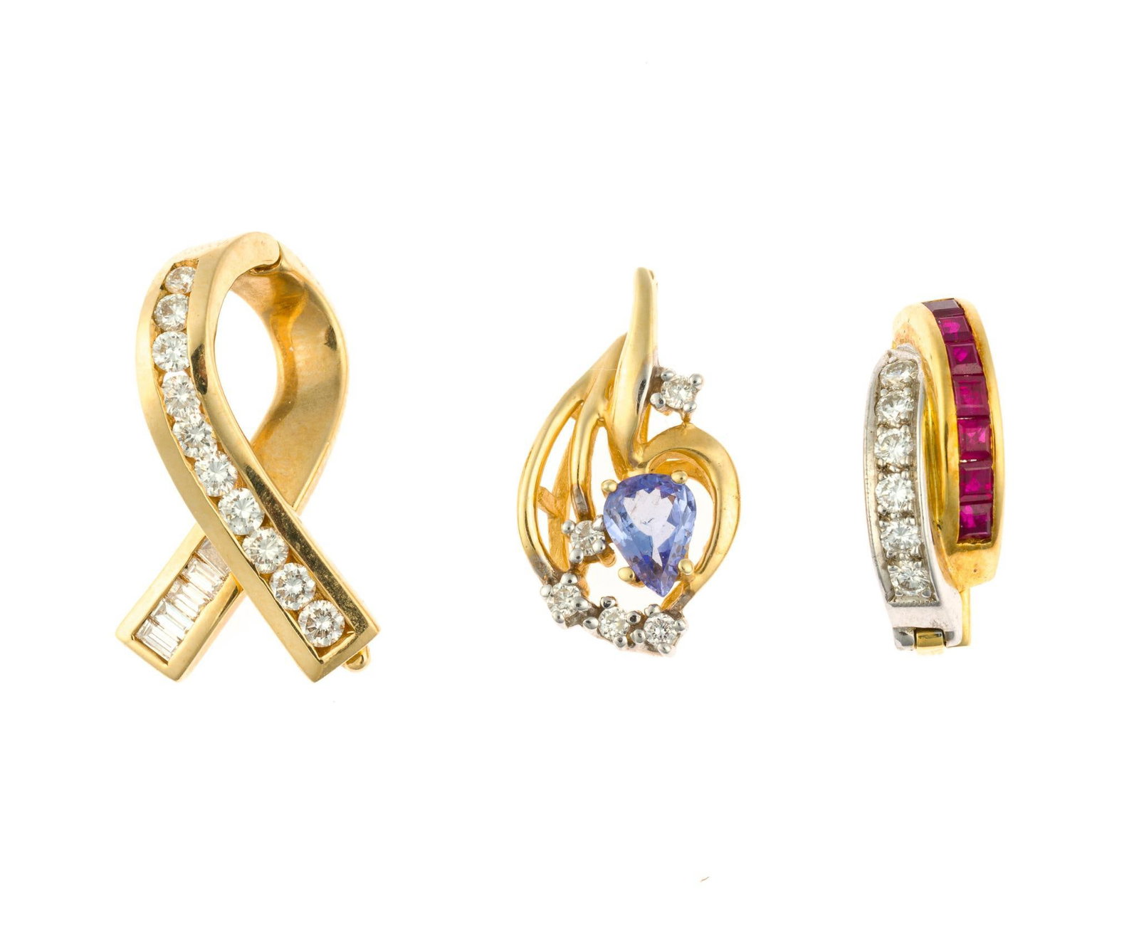 Three 14K and 18K Gold Pendants and Enhancers: One 18k yellow and white gold with round diamonds and baguette cut rubies. One a ribbon form in 14k yellow gold with round channel set diamonds. One with tanzanite and diamonds is not marked but 