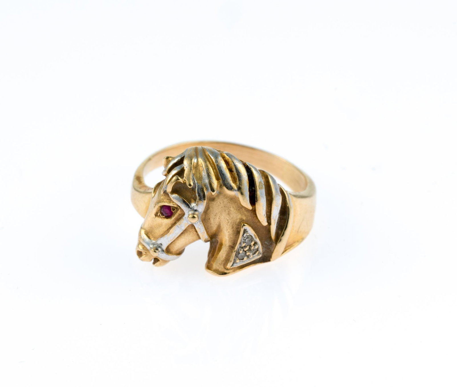14K Gold Equestrian Cocktail Ring: A yellow gold size 5 ring with a horse portrait and ruby eye. It tests 14k, sanded inside the band during a past resizing. It weighs 4.1 grams 