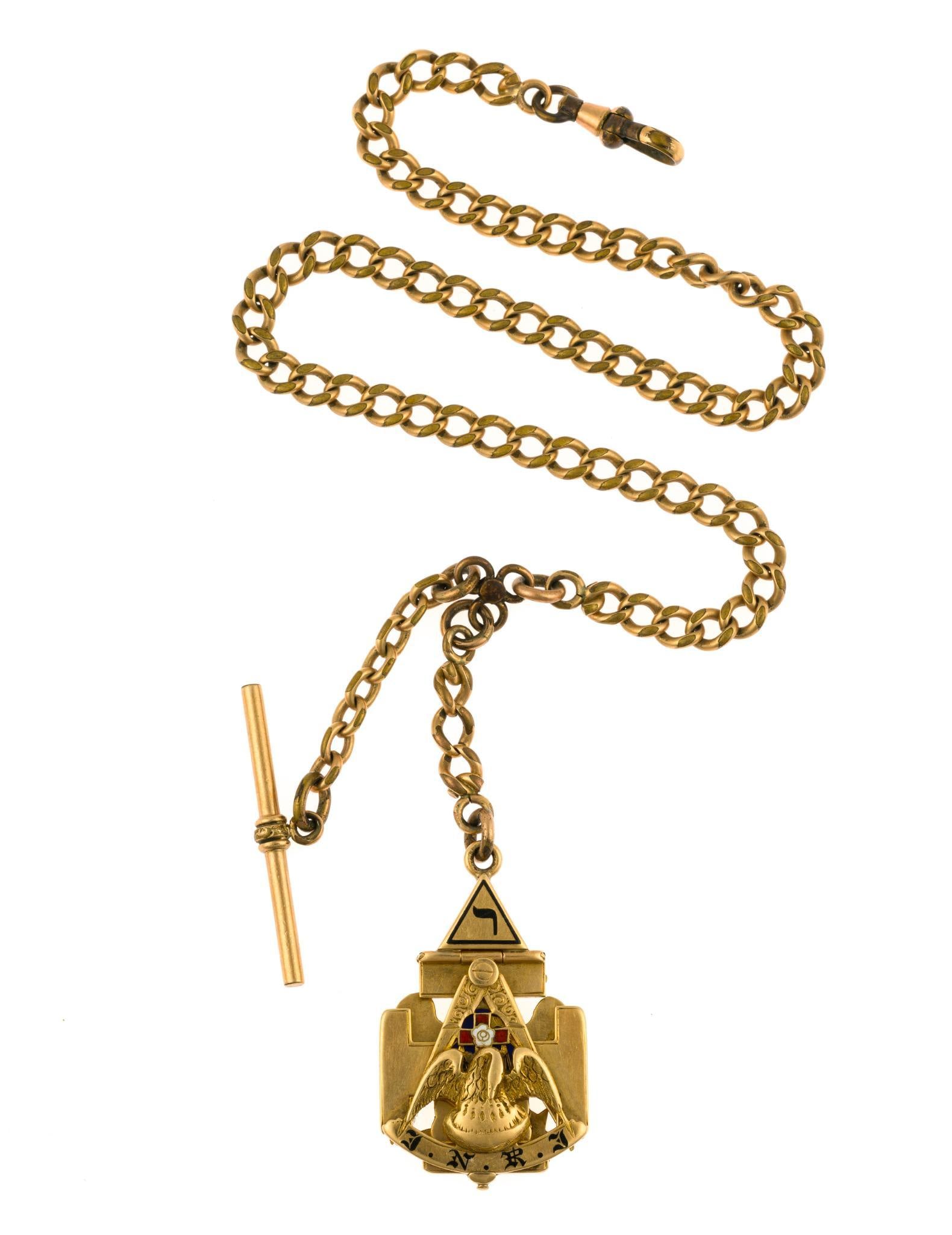 14K Gold Masonic Watch Fob 32nd Degree: The watch chain is gold filled and the double hinged 32 degree Scottish Rite fob is 14k. The gold fob, not including the chain, weighs 24.7 grams. 