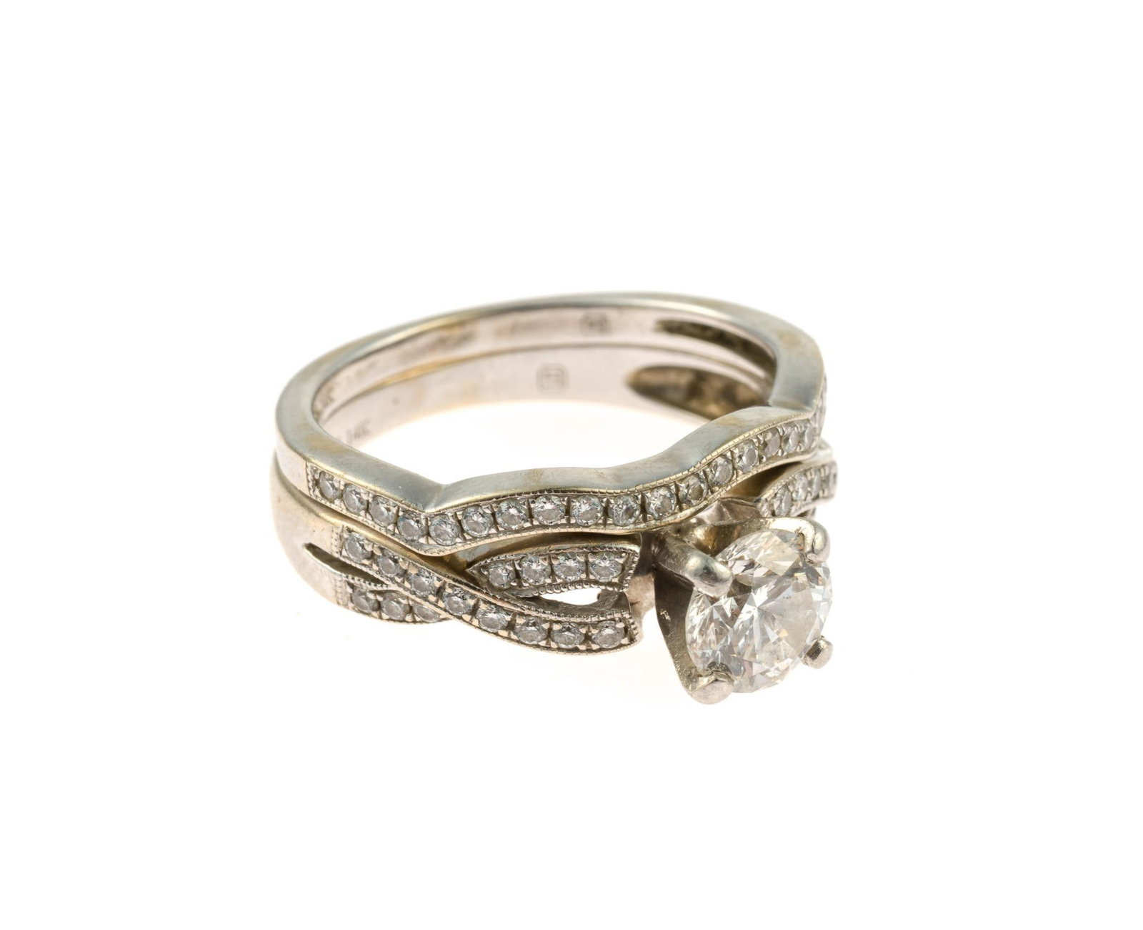 14K Gold and 1.19 CTW Diamond Wedding Set w/ GIA Report: A size 6 matching white gold wedding band and diamond engagement ring. The engagement ring has a GIA graded diamond of 0.86 carat, Clarity SI2, Color G. There are 30 additional round diamonds enhancin