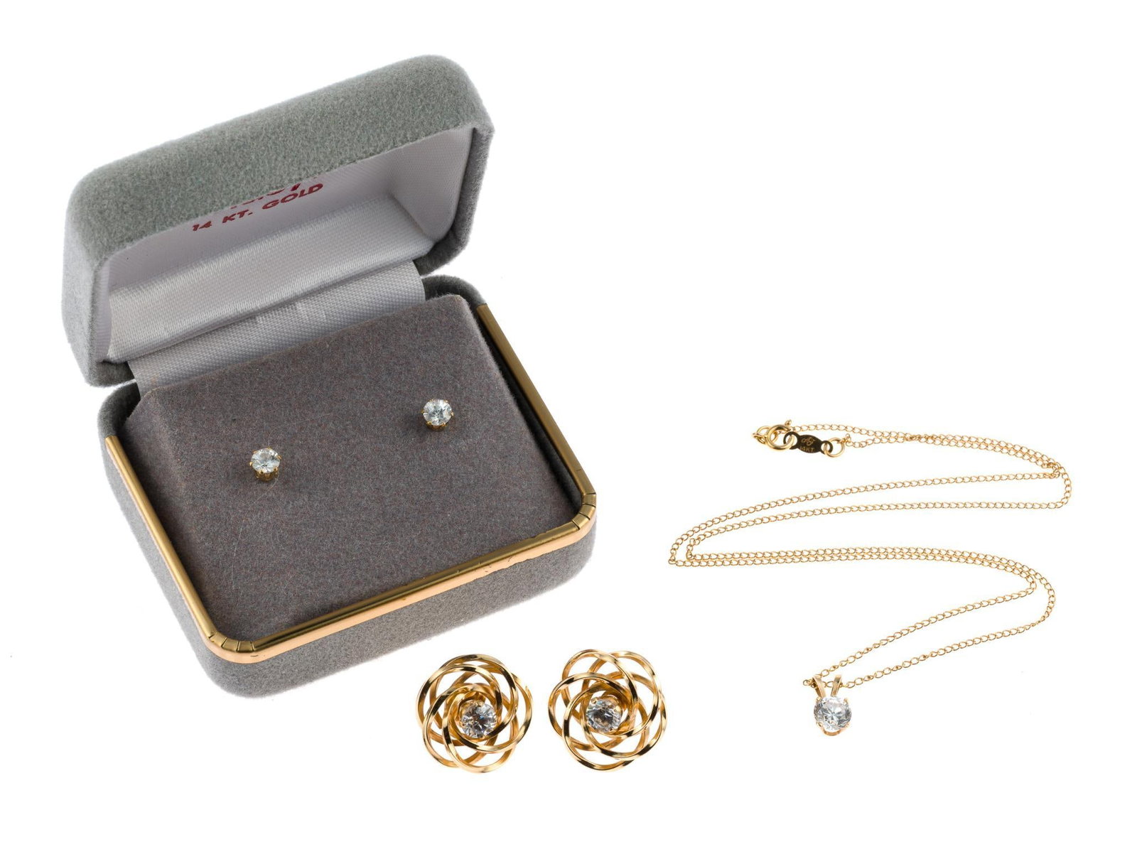3 14K Gold and CZ Jewelry: Stud earrings in original box. Stud earrings with jackets, 5/8" width. 16" length chain with solitaire pendant. Total weight not including studs in box with non-gold backs, 4.2 grams. 