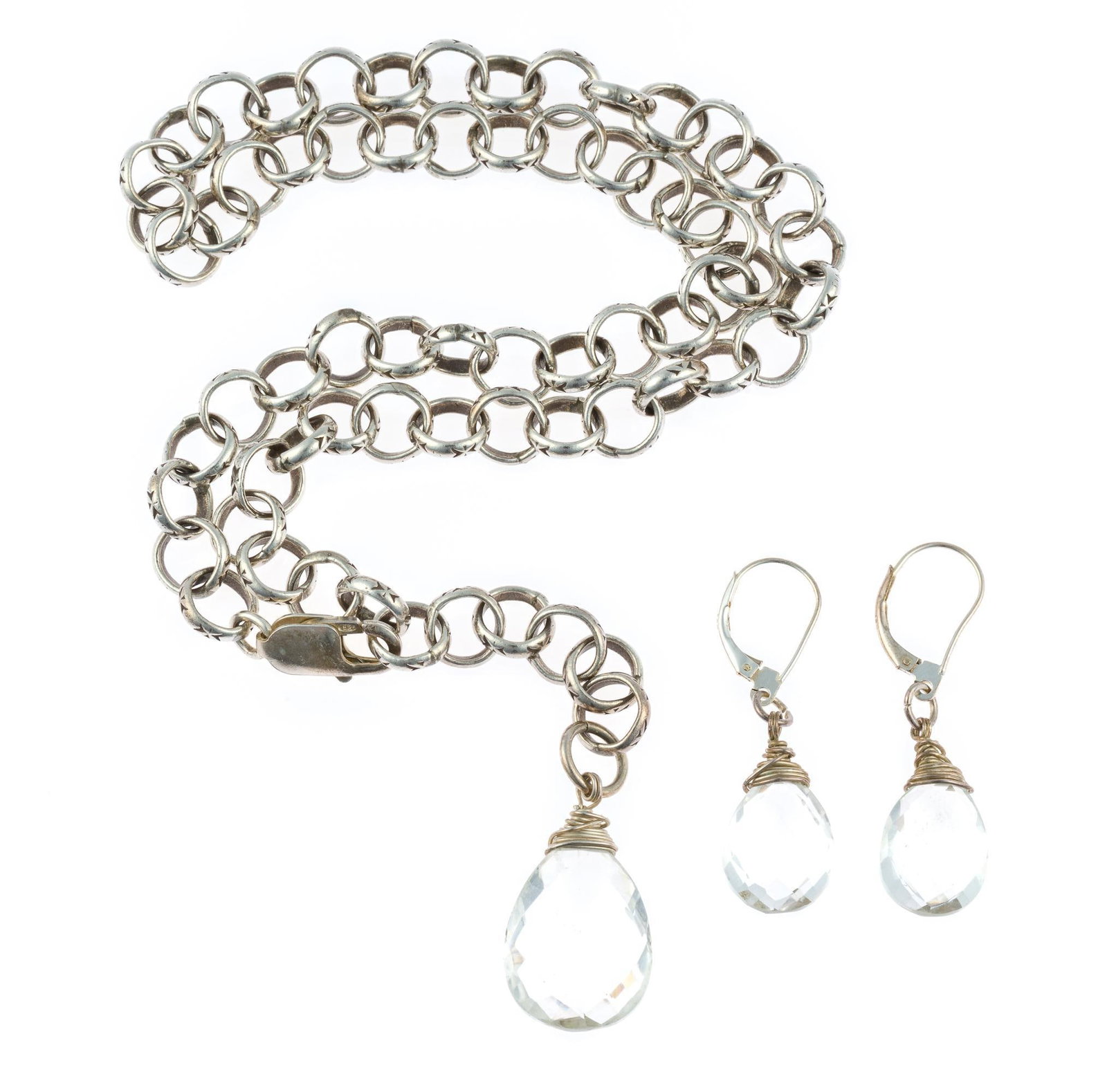 Sterling Silver and Quartz Necklace and Earrings Set: An 18" chain necklace in sterling with matching earrings for pierced ears. The necklace has a pendant and the earrings earrings have dangles of pear-cut quartz crystal. The total weight is 1.5 tr