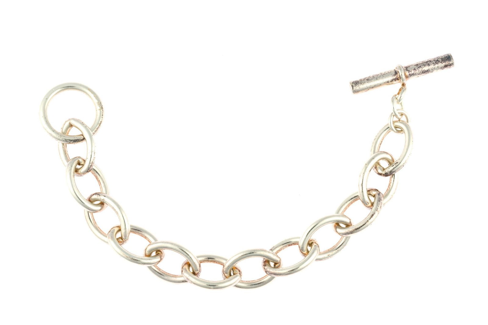Sterling Silver Chain Bracelet: An 8" chain link bracelet in the manner of Tiffany. It is marked 925 Germany with maker's mark and weighs 1.7 troy ounces.