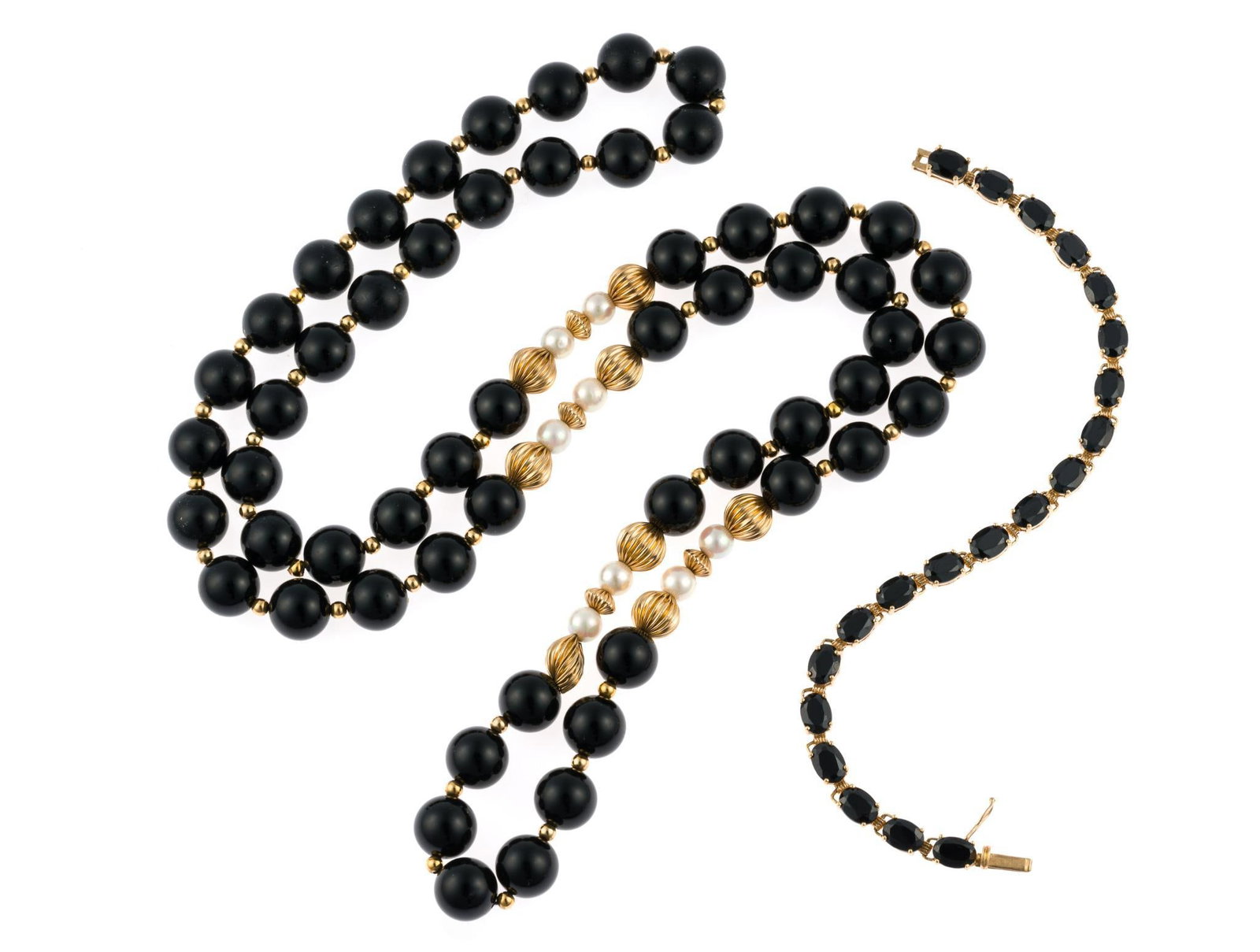 14K Gold and Onyx Bracelet and Necklace: A 7" yellow gold bracelet with faceted oval onyx gemstones. It weighs 10.2 grams. A 32" onyx, pearl and gold bead necklace. The gold beads test 14k, the necklace is not marked. One gold bead with dama
