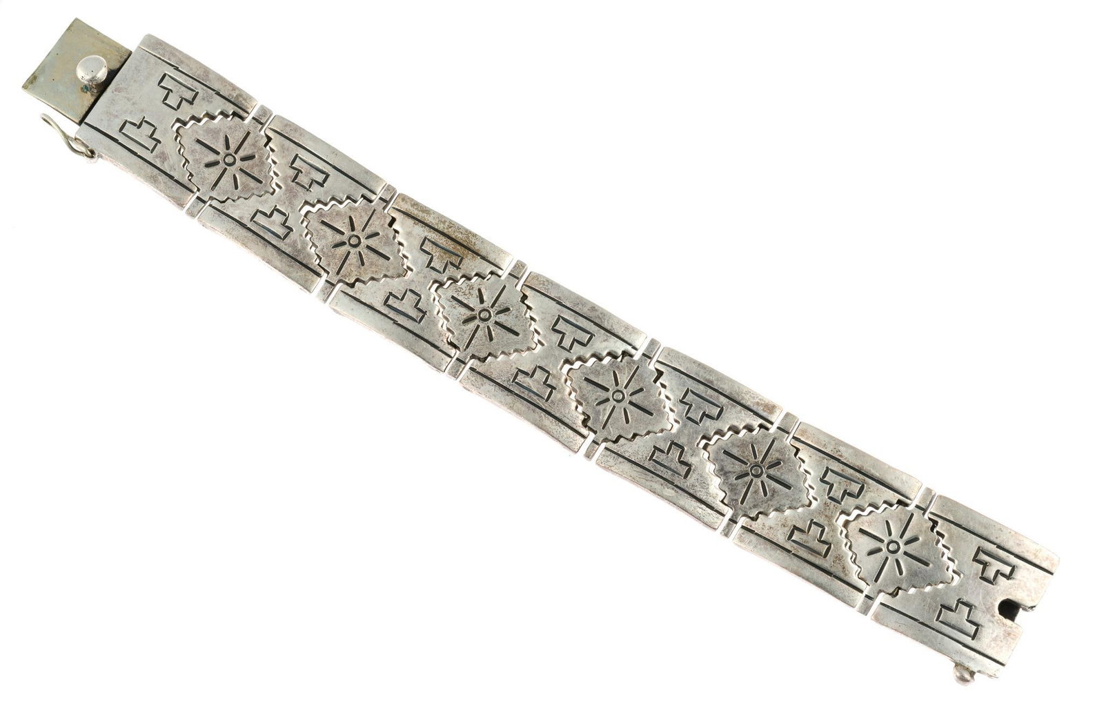 Mexican Sterling Silver Bracelet: A heavy bracelet in sterling silver with curved plate links. It is 8" in length and weighs 4.9 troy ounces. It is marked Mexico 925