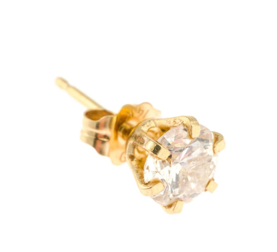 Single 14K Gold and .75 Ct Diamond Stud Earring: Approximately 0.75 carat (5.55mm x 5.60mm x 4.03mm) diamond stud earring. Clarity I1 and Color H/I. The earring is marked 14k. The weight is 0.5 grams.