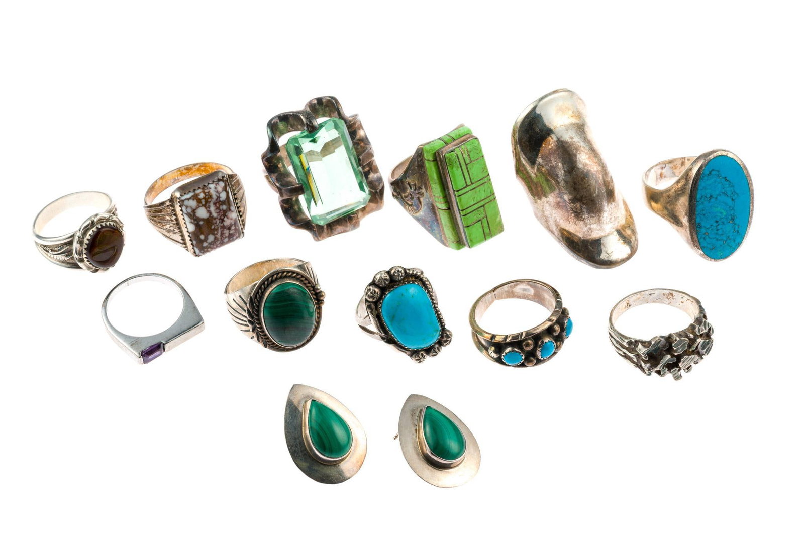 11 Sterling Silver Rings and Earrings: Includes tiger's eye, turquoise, amethyst, malachite, and more. The rings are mostly size 9 through 10 with a few smaller and larger. Everything is marked for sterling. The total weight is 3.9 troy ou