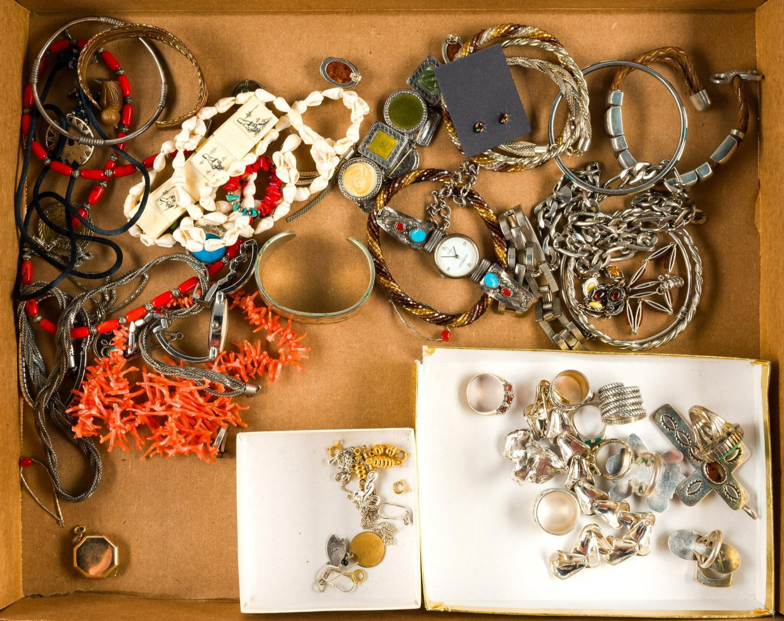 Sterling Silver and Costume Jewelry: Much of what appears to be sterling silver is unmarked but some pieces are marked for sterling. The lot includes a quartz watch with sterling, turquoise, and coral ends signed J.W. There is a qua