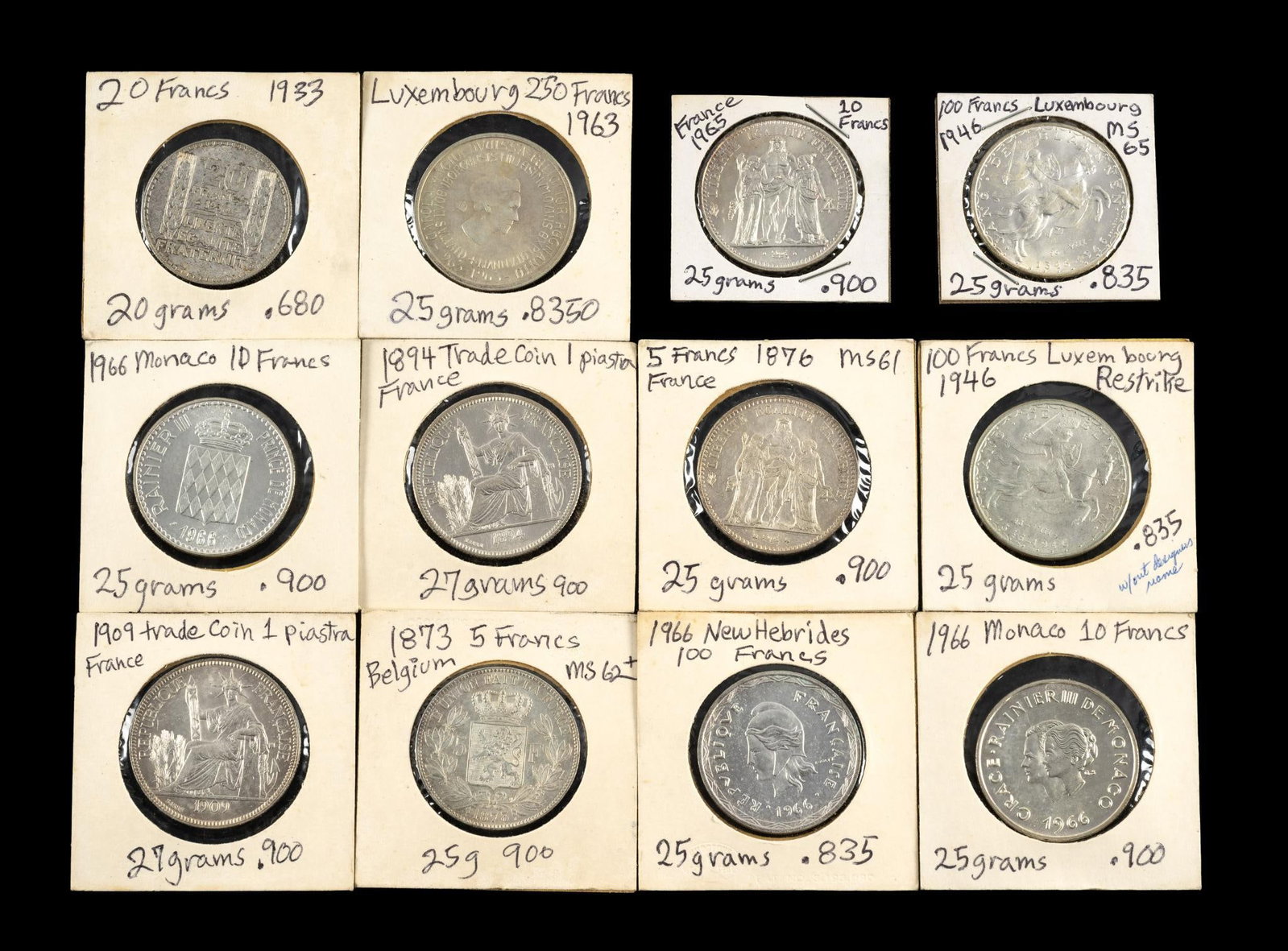 Uncirculated Silver European Coins: Twelve coins include France, Monaco, Belgium, Luxenbourg, New Hebrides. Dates are from 1894 to the 1970's. Better coins include 1894 A French Indo-China Piastre, 1909 A French Indo-China Piastre, and 
