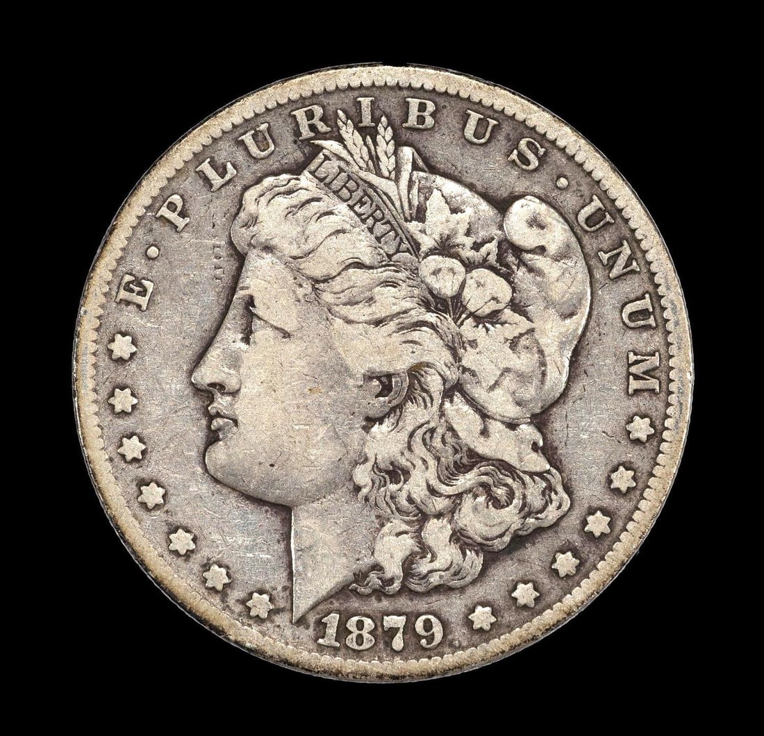 1879-CC Carson City Silver Dollar: 1879-CC with no damage or obvious past cleaning hairlines. Approximately VF20-25.