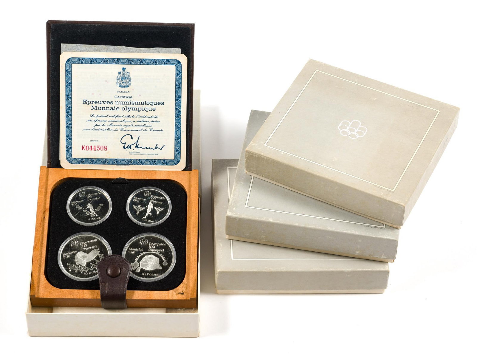 Four 1976 Montreal Olympic Silver Coin Sets: Each set has four sterling silver .925 coins with ASW, actual pure silver content of 4.34 troy ounces per set. All seven sets in the series are offered in two lots, four in this lot and three in the s