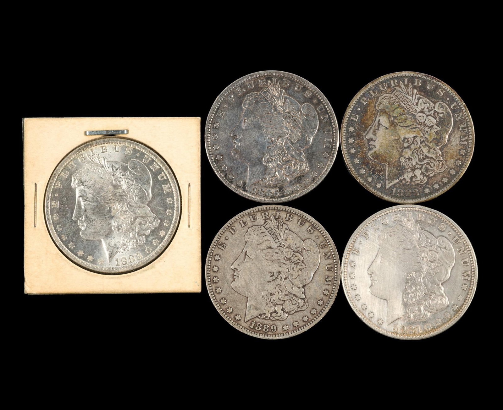 Five Morgan Silver Dollars: Common dates with 1883-O in MS63 or MS64, no past cleaning. 