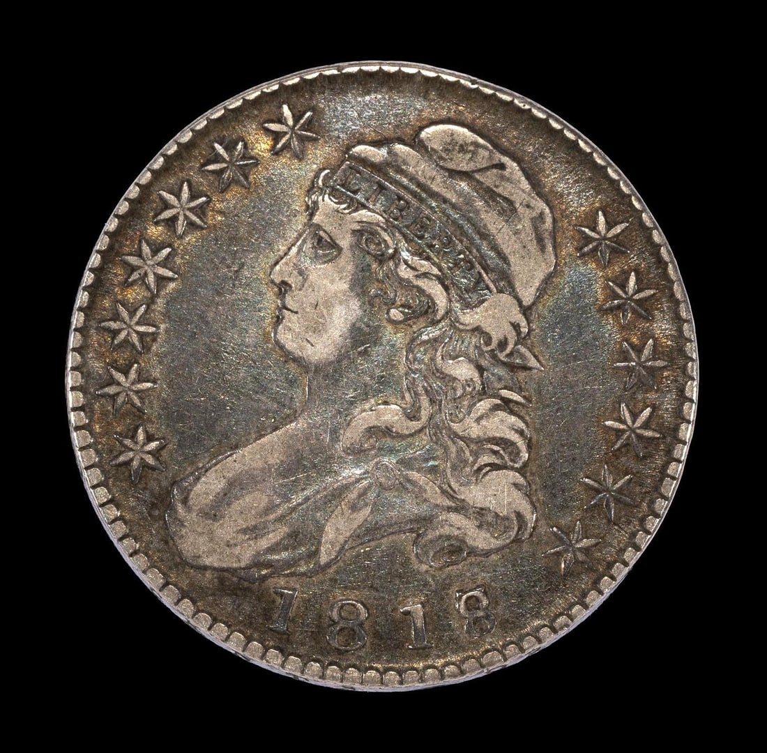 1818/7 Capped Bust Half Dollar: An exceptional 1818/7 large 8 (1818 over 7). A VF35 coin with cameo wear to the high areas supporting the fact that it has not been detrimentally past cleaned. The fields have some rainbow toning to