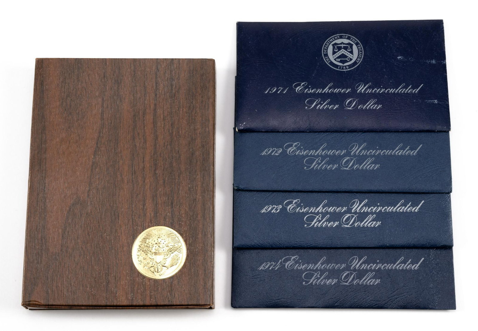 Five Silver Eisenhower Dollars: Four uncirculated dollars and one proof, all 40% silver.