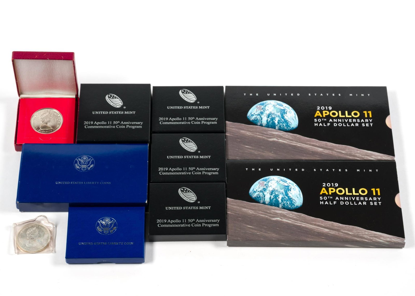 Commemorative US And Bahamas Including Silver: Apollo 11 proof silver dollar .999 fine 26.7 grams, five Apollo 11 clad coin sets, one United States Liberty set with a silver dollar, one proof and one uncirculated 1971 Bahama Islands sterling