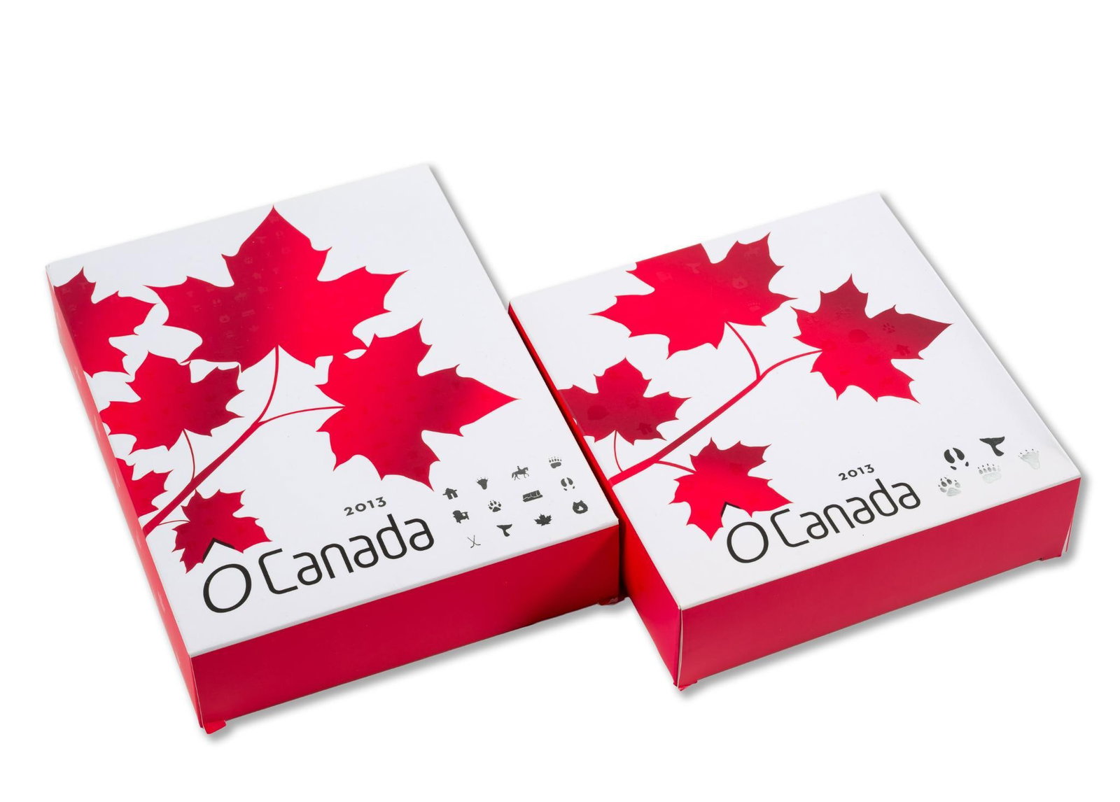 O Canada Pure Silver Coin Sets 2013: Two sets of .999 fine silver coins from The Royal Canadian Mint. One set contains twelve coins of 15.87 grams each and one set has five one-troy-ounce coins. Over eleven troy ounces in total.