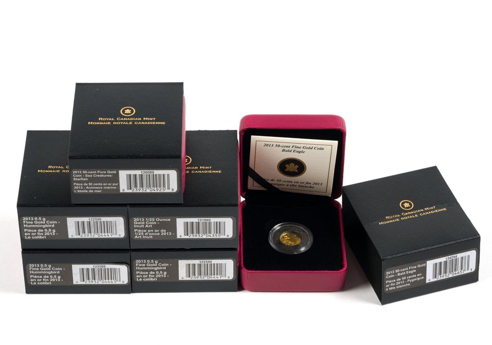 Six Pure Gold Canada Coins 2013: Three coins weigh 0.5 grams each and three coins weigh 1.27 grams each. They are commemoratives of Sea Creatures - Starfish, Bald Eagle, Inuit Art and Hummingbird.