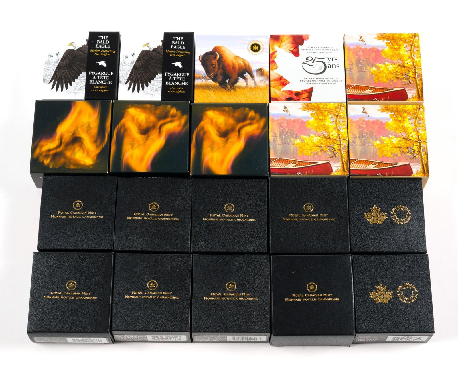 Twenty Canada Pure Silver One Troy Ounce Commemorative Coins: 2013 Commemorative coins of the Royal Canadian Mint. Themes include The Bald Eagle, The American bison, Howling Wolf, Untamed Canada Pronghorn, Holiday Wreath, Autumn Bliss, Iris Versicolor, Canadian 