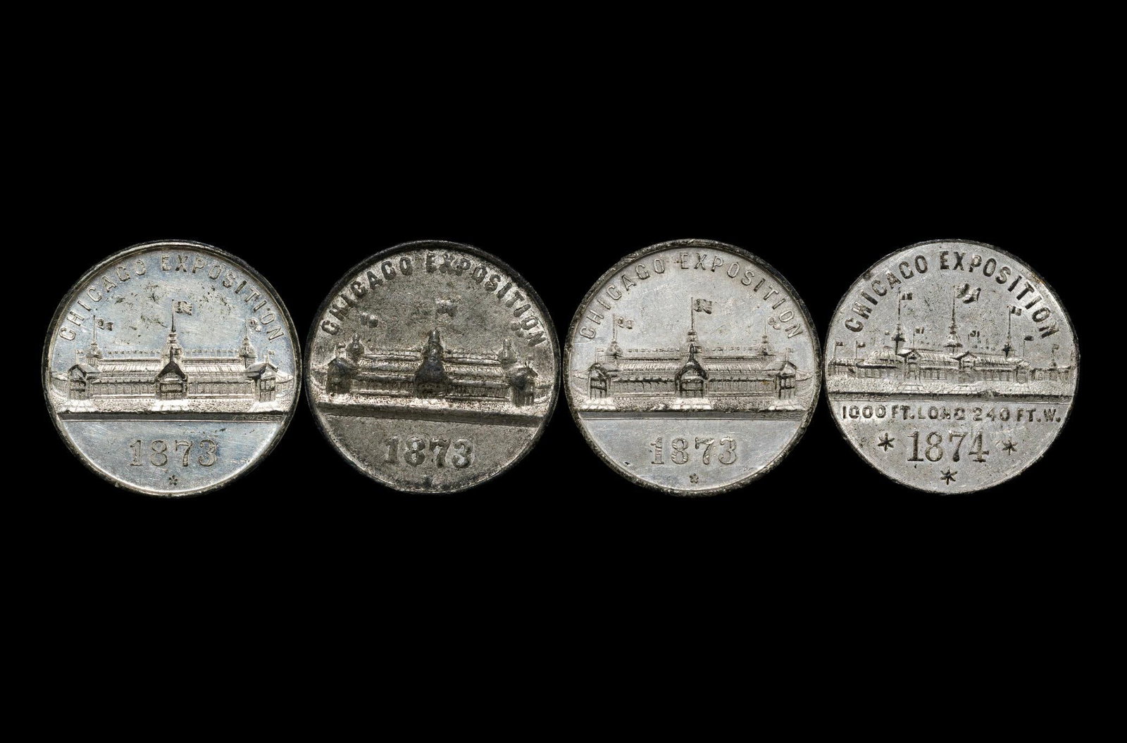 Four Chicago Exposition 1873 1874 National Elgin Watch Co. Medals: Three 1873 and one 1874. Scarce and well preserved medallions. Not past cleaned. They have original surfaces.