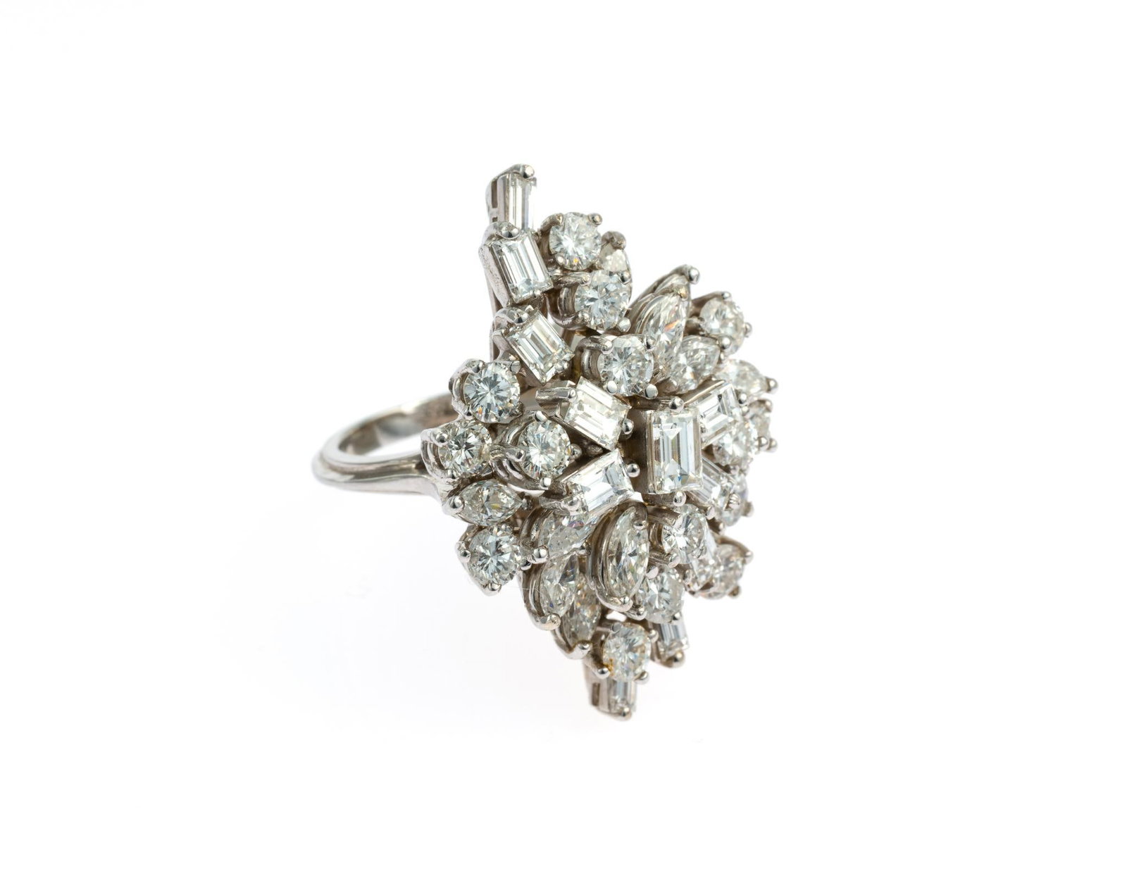 18K Gold & 5 CTW Diamond Cocktail Ring: 18k white gold setting with mix of thirty-six emerald cut, round brilliant cut, and marquise cut diamonds ranging from approximately .10 carat to .40 carat. Clarity VS2 to I1, Color G-H. Two of the sm