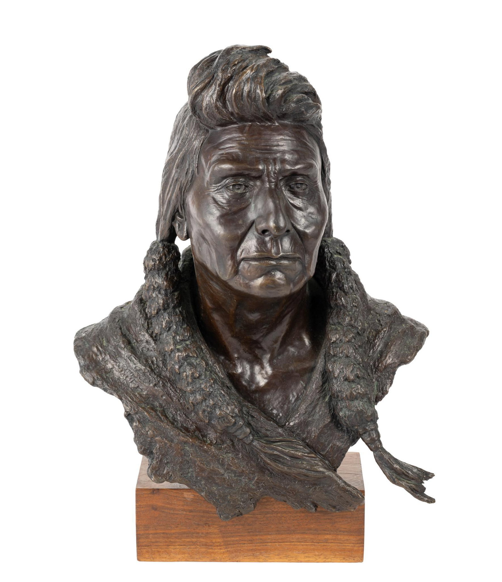Steven L. Knight Bronze Native American Bust Sculpture: A bronze bust of a Native American by Steven L. Knight produced in 1984 in an edition of 19/29 pieces. The height is 18" and it weighs 41 pounds not including the base. It has become detached