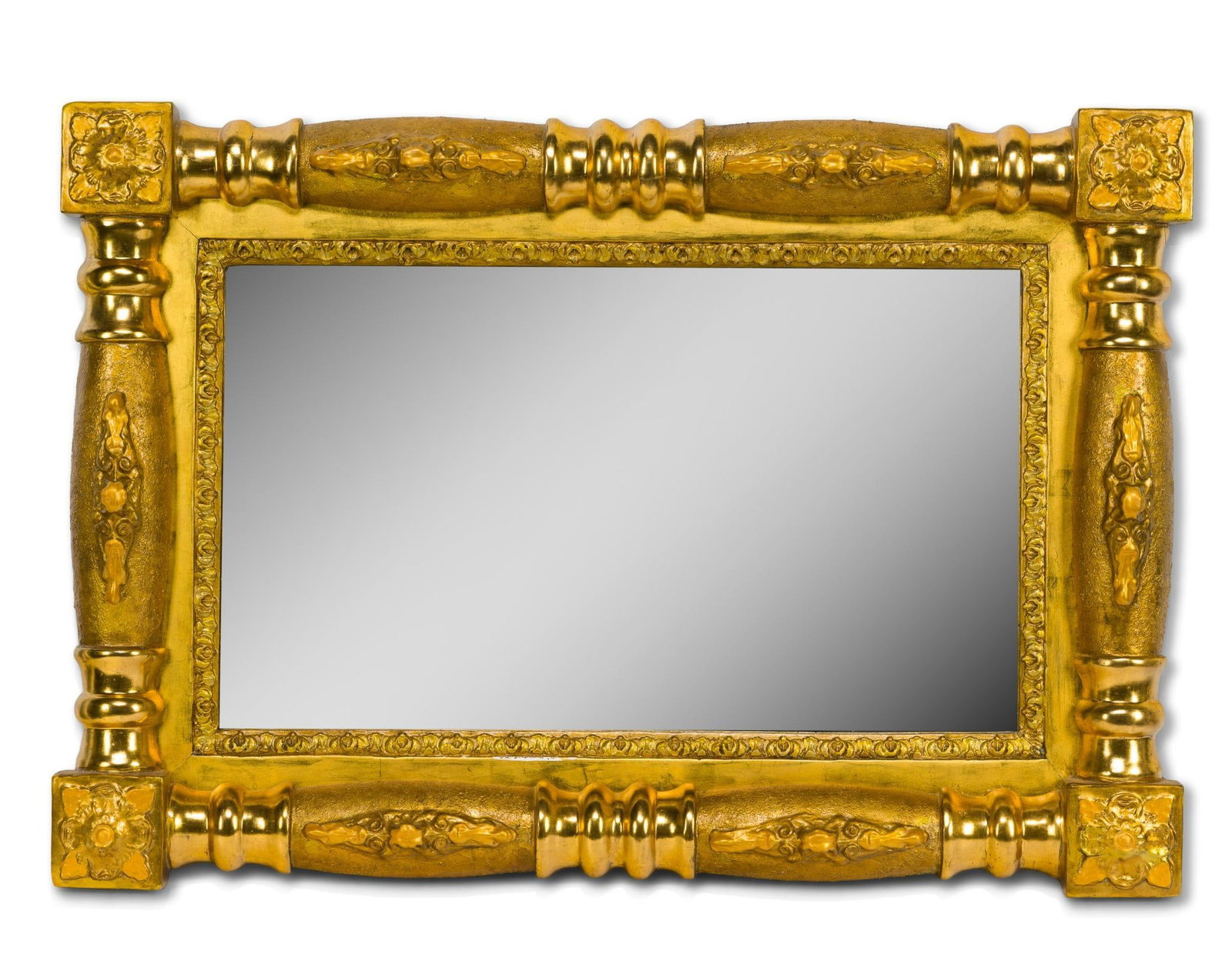 American Federal/Early Empire Giltwood Wall Mirror: Circa 1810–1825, rectangular frame with elaborately turned giltwood members, raised foliate and floral ornament, and floral rosette corner blocks, enclosing a rectangular mirror plate within a