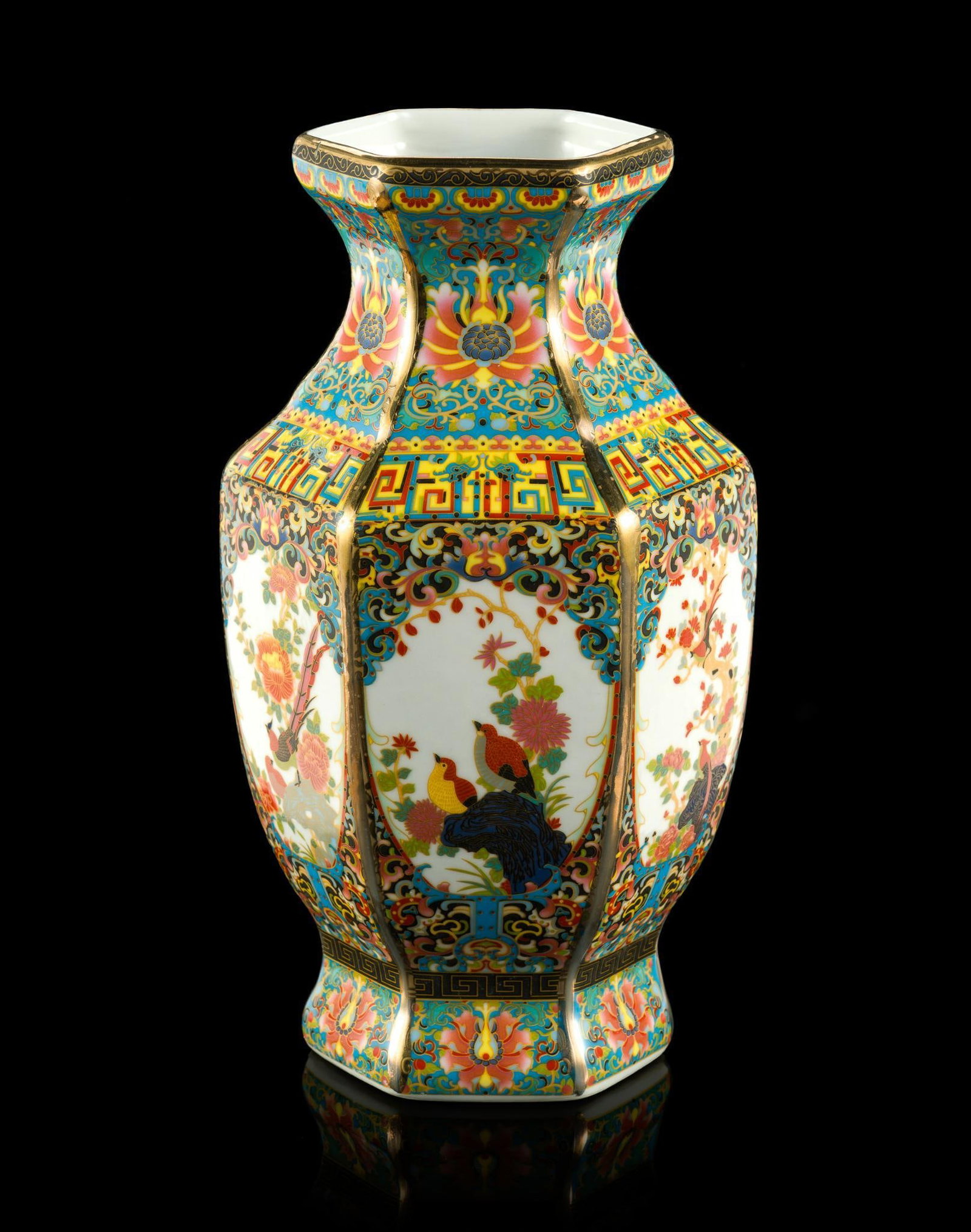 Chinese Famille Rose Hexagonal Vase: The vase is 9 3/4" in height and is marked Qianlong Yu Zhi to the base. It has no damage or repairs. 