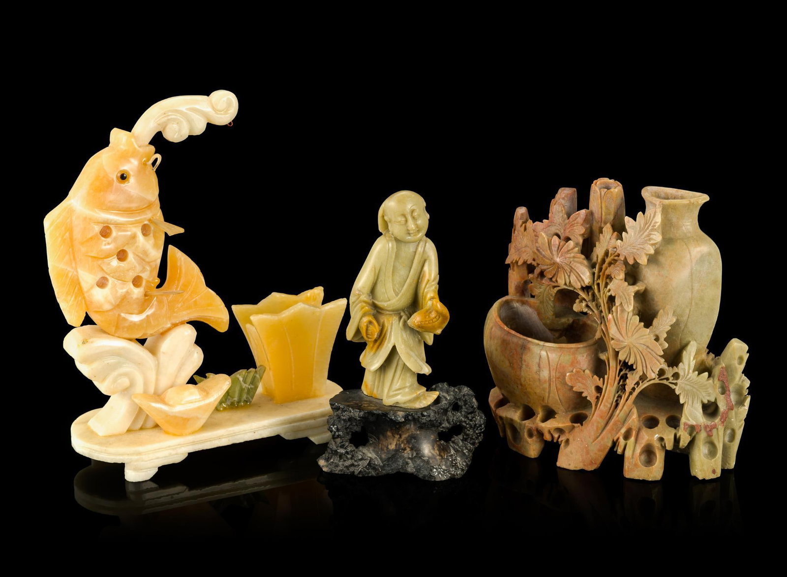 3 Chinese Carved Soapstone Desk Objects: Includes a carving of a leaping carp on base, a carving of a Chinese Immortal, and a vase and brush washer. The largest is 8" height.