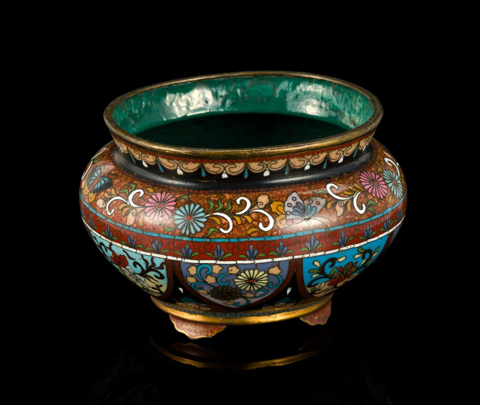 Japanese Cloisonne Tripod Censer: A 4" diameter four footed bowl in bronze with cloisonne work to the exterior.