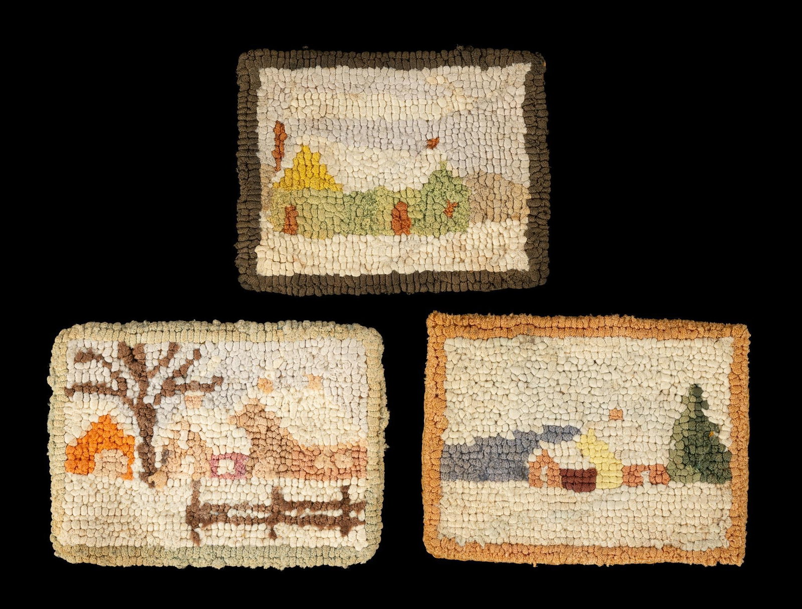 3 Mini Grenfell Hooked Rugs: Three miniature pictorial hooked mats, attributed to the Grenfell Mission, Newfoundland and Labrador, early 20th century, each depicting a northern house or settlement scene in muted shades of cream, 