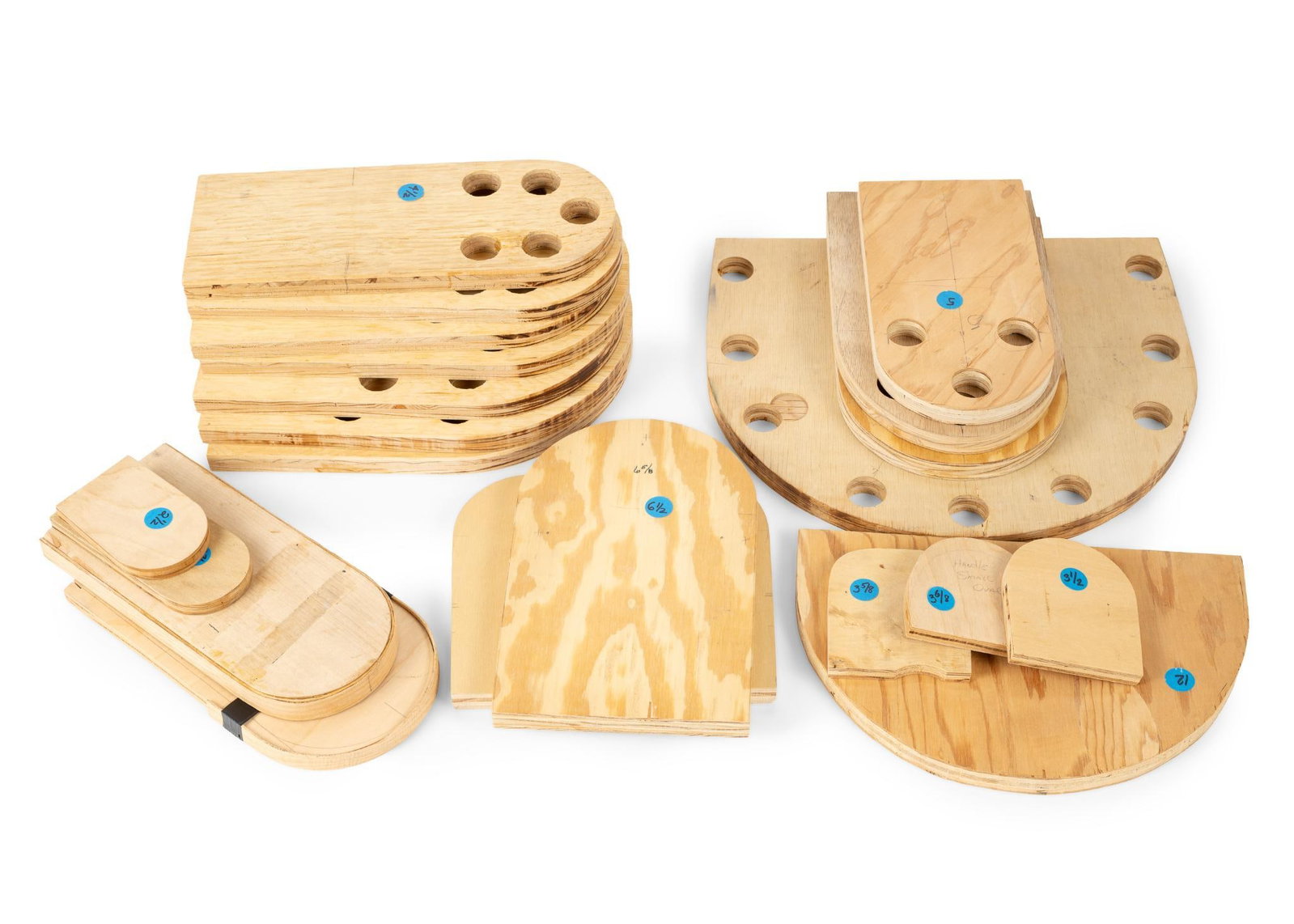 Nantucket Basket Handle Molds: Over 20 basket handle molds. All in fair condition. From the workshop of Jim Servia. Smallest measures 2-1/2" x 4"; largest measures 14" x 12". Provenance: From the collection of veteran Jim Servia