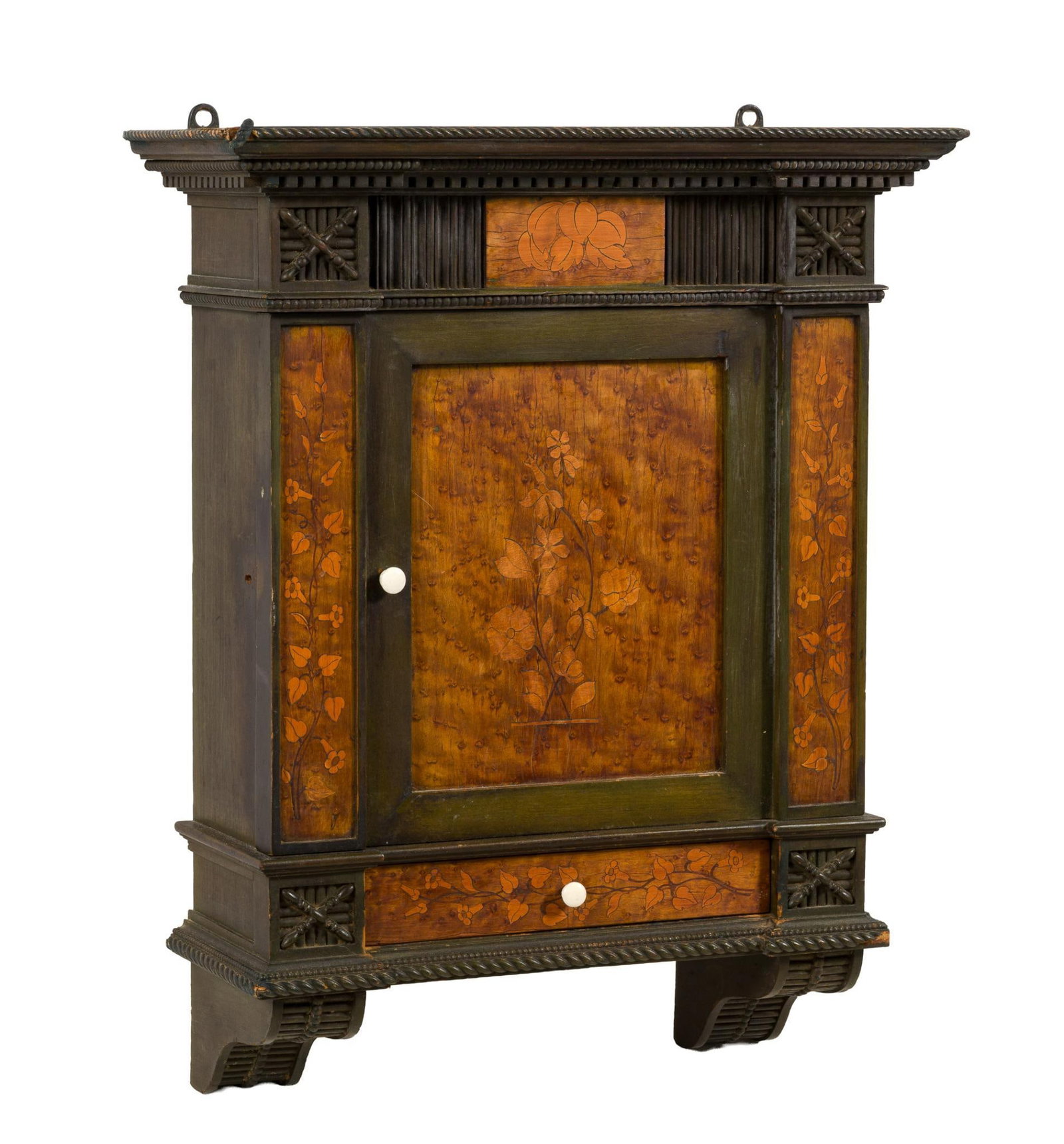 Victorian Gothic Revival / Aesthetic Movement Hanging Cabinet: Circa 1870–1885 hanging cabinet, in the Gothic Revival taste with Aesthetic Movement influence, having a dark ebonized or painted carved-wood frame with architectural molded cornice, rope and de