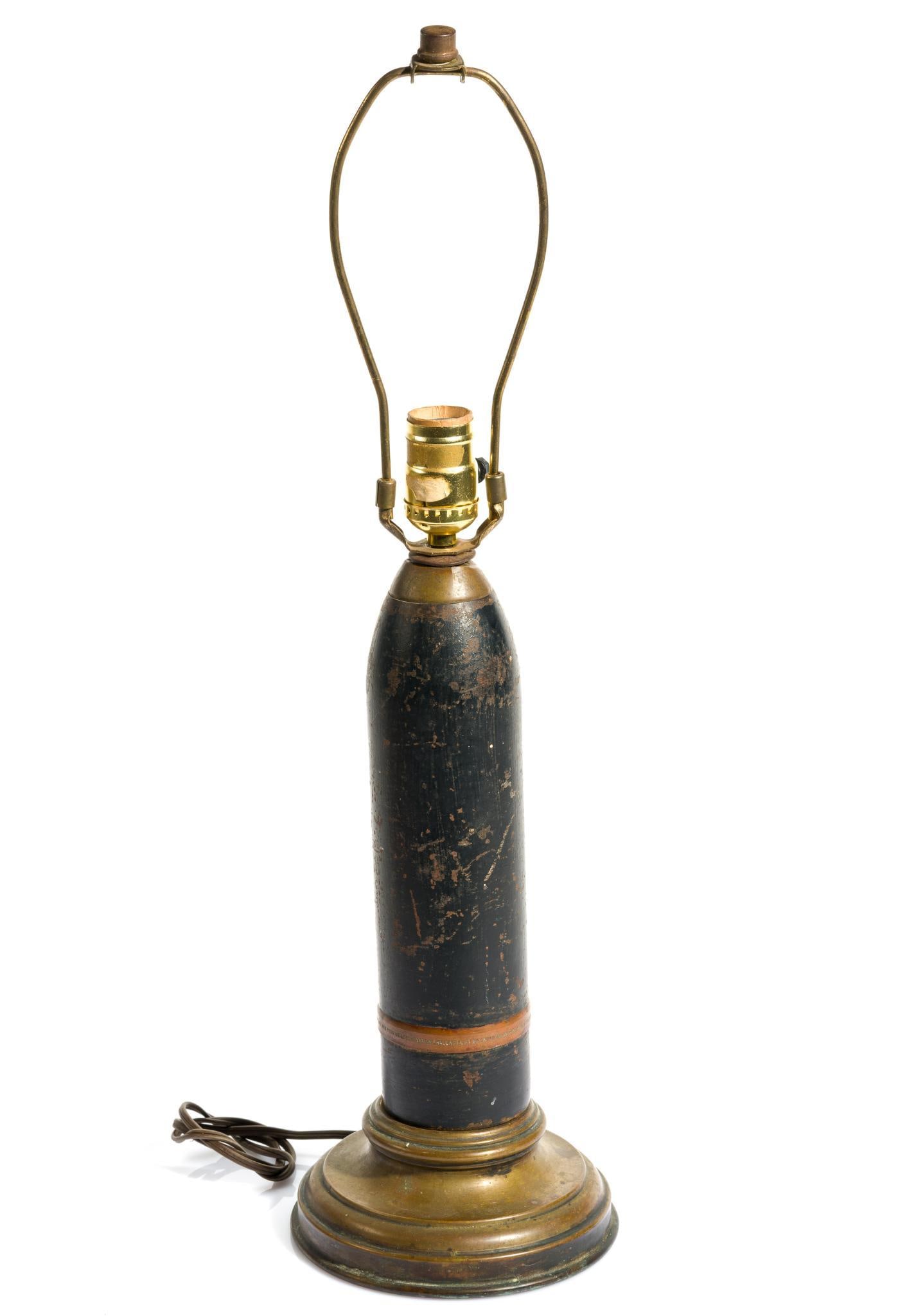 WWI Shell Lamp: Made from 75mm steel shell recovered from the explosion at T.A. Gillespie Loading Plant, Morgan N.J. October 4, 1918. The Gillespie Plant was the largest shell-loading plant in the U.S., and the blast