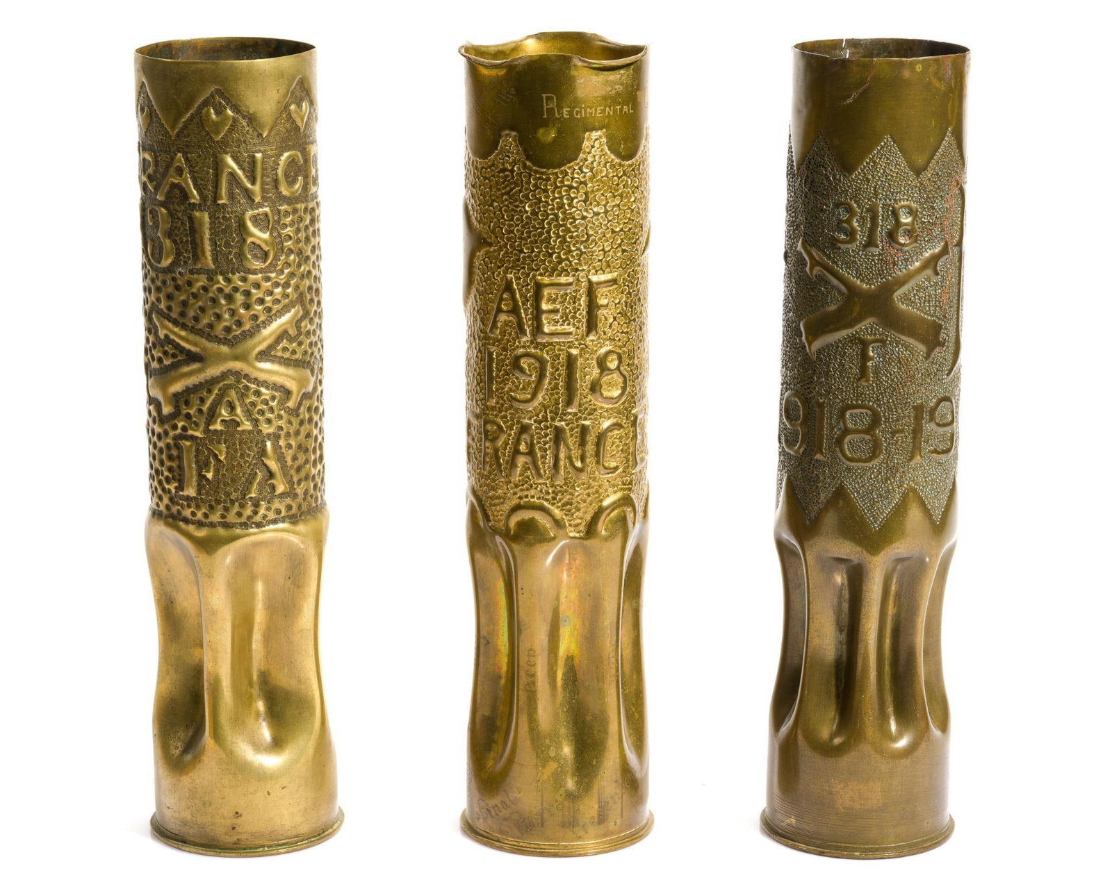 3 WWI Trench Art Shells: Includes (1) Trench art presentation shell vases. Embossed on side "AEF/1918/France"; and engraved around bottom "Presented to Boche at Bois de Prete/Nov 11 1918." The presentee of the shells,