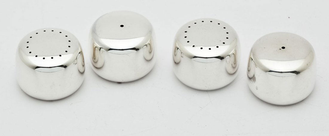 2 Pairs Georg Jensen Sterling Pebble Shakers: DESCRIPTION: Two pairs of sterling silver Georg Jensen Pebble salt and pepper shakers. Designed by Henning Koppel. Each marked with Jensen hallmark and "Sterling". MEASUREMENTS: 1-3/8" x 1". CONDITION
