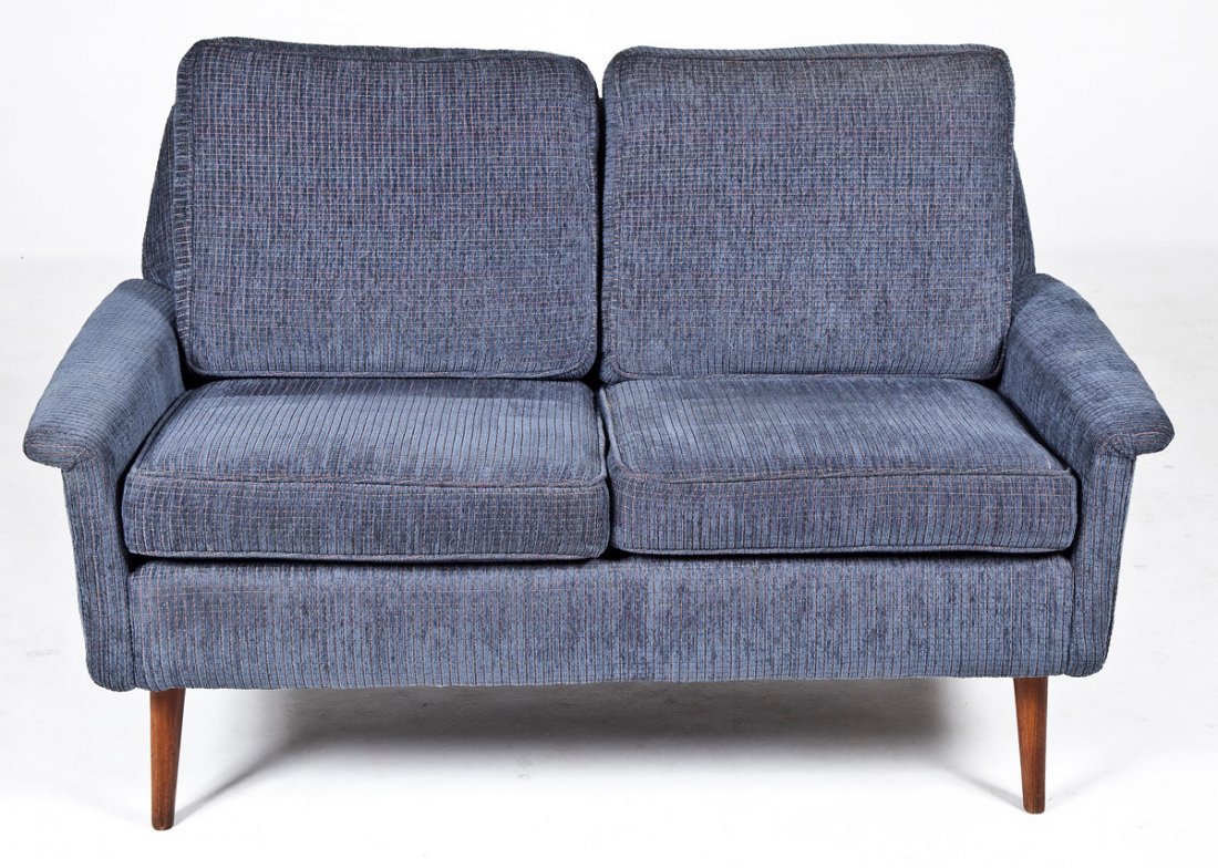 Modern Dux Style Upholstered Loveseat: DESCRIPTION: Dux style loveseat with cloth upholstery in blue chenille. Wood splay legs. MEASUREMENTS: 52" x 22" x 28". CONDITION: Minor wear.