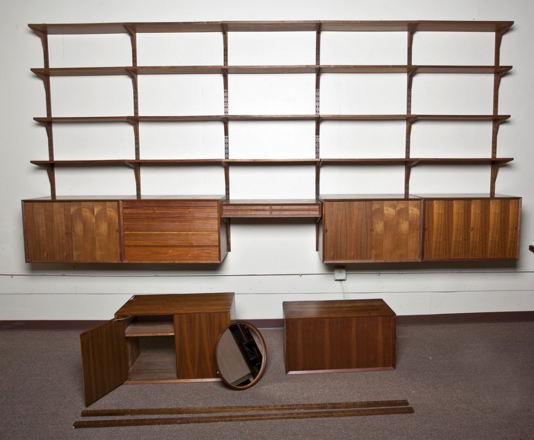 Poul Cadovius Cado Danish Modern Teak Wall Unit: DESCRIPTION: Danish Modern modular teak wall unit, attributed to Poul Cadovius. Cado system. Comprising five sets of four adjustable shelves over five cabinets (three with sliding doors, one with four