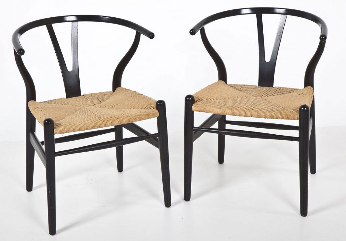 Pair of Hans Wegner for Carl Hansen Arm Chairs: DESCRIPTION: A pair of Hans Wegner for Carl Hansen wishbone arm chairs. Formed sides and back in black lacquer. Woven jute seats. Stamped "Made in Denmark by Carl Hansen & Son Odense Denmark". MEASURE