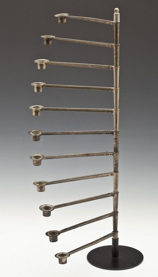 Laurids Lonborg 11 Arm Candelabra: DESCRIPTION: Danish modern eleven arm candelabra by Laurids Lonborg. Adjustable swing arms on a black enameled base. With "Laurids Lonborg Denmark" label under base. MEASUREMENTS: 19-3/8" high. CONDIT