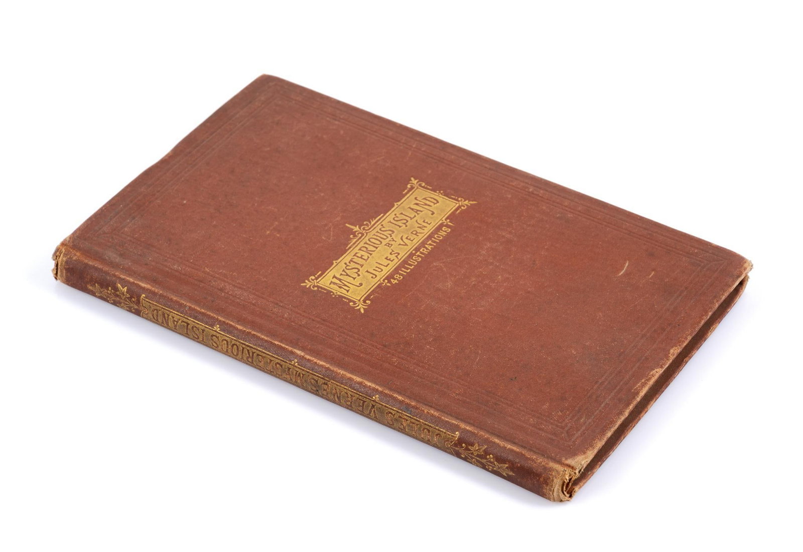 Mysterious Island By Jules Verne Authorized 1st American Edition: First authorized American edition with red cloth cover, slight damage to the top and bottom of the spine and general wear which is expected with age and use. Measures 6" x 9-1/2".