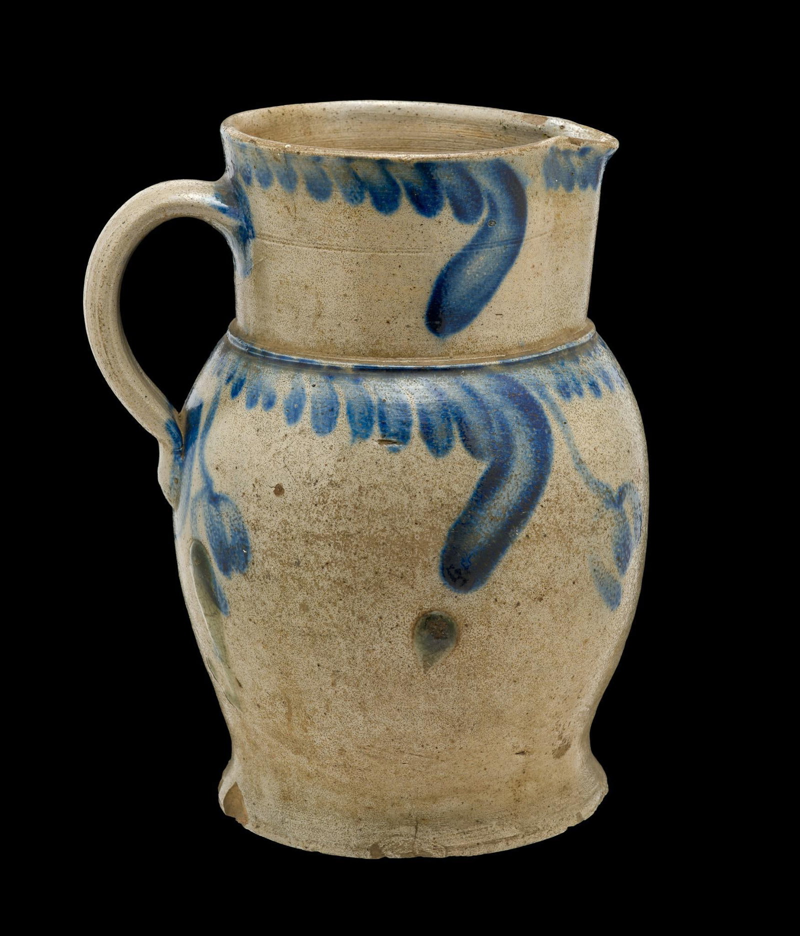 19th Century Baltimore, Maryland Cobalt Decorated Stoneware Pitcher: Blue Cobalt decoration. The pitcher is 8 1/2" in height. It has old chipping to the base and stress cracks within the body, no repairs.