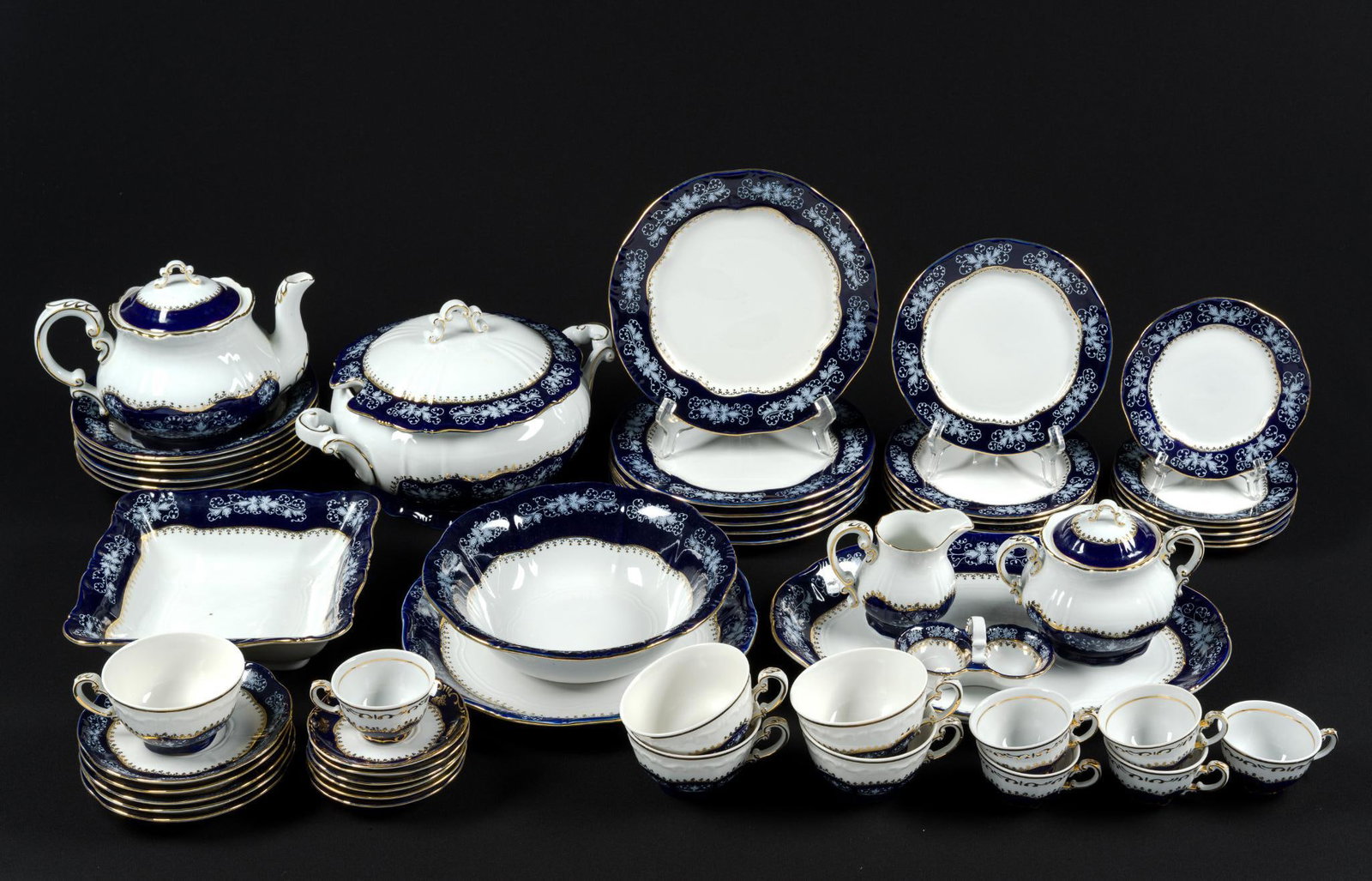 Zsolnay Pompadour Tea Service: 52 pieces. Largest oblong platter measures 14-1/2" x 10-1/4" and the dinner plate measures 9-1/2" in diameter. 