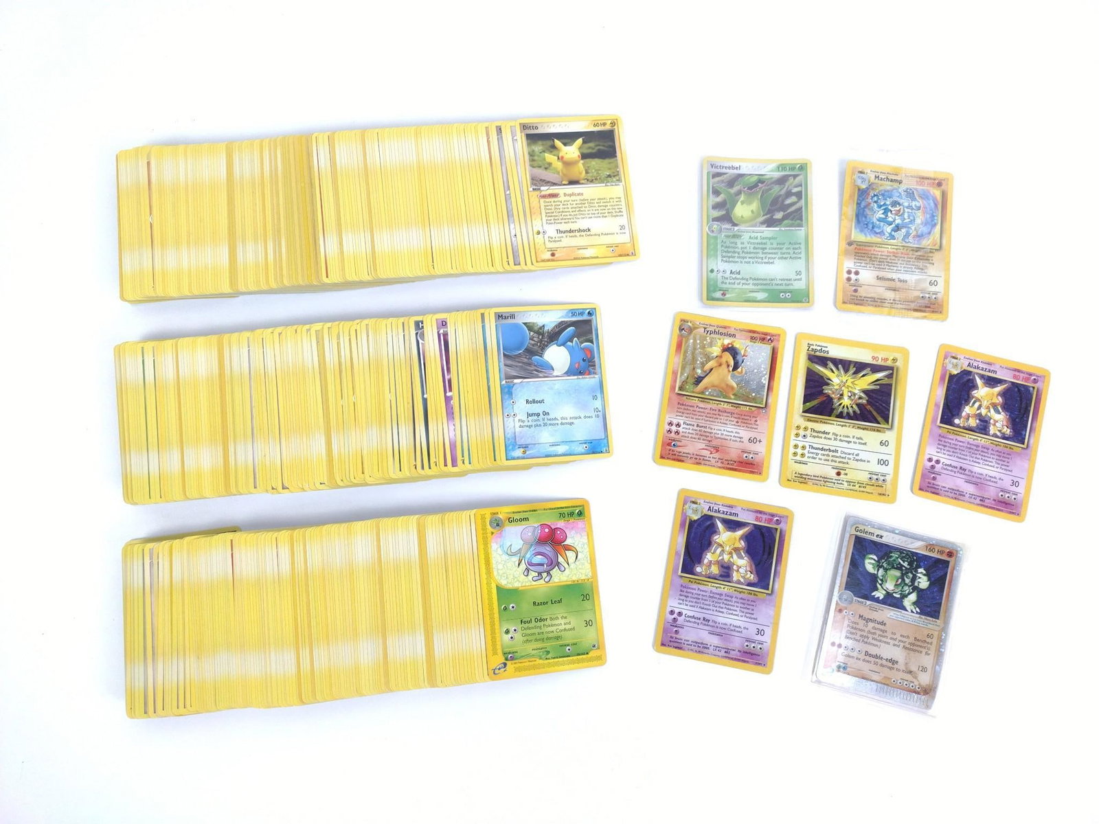 Pokemon Cards Incl. Typhlosion Neo Genesis 17/111: Also includes a first edition Machamp still in its plastic from original game pack, two Alakazam base set 1/102 holographic 1999-2000, Zapados 16/102 holographic base set and more!
