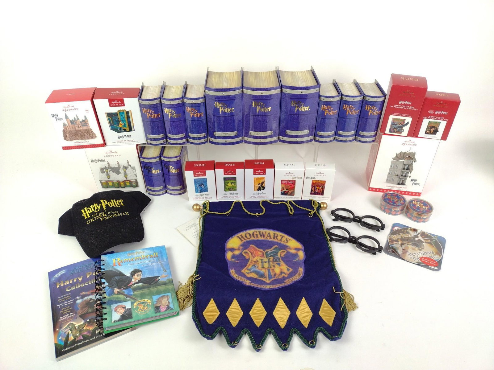 22 Pewter Harry Potter Hallmark Ornaments & Hat: Includes 11 Hallmark Keepsake Ornaments, 11 yearly Hallmark keepsake figurines, 2 pair of Harry Potter costume glasses, Harry Potter and the Order of the Phoenix hat, and more. All in good condition.