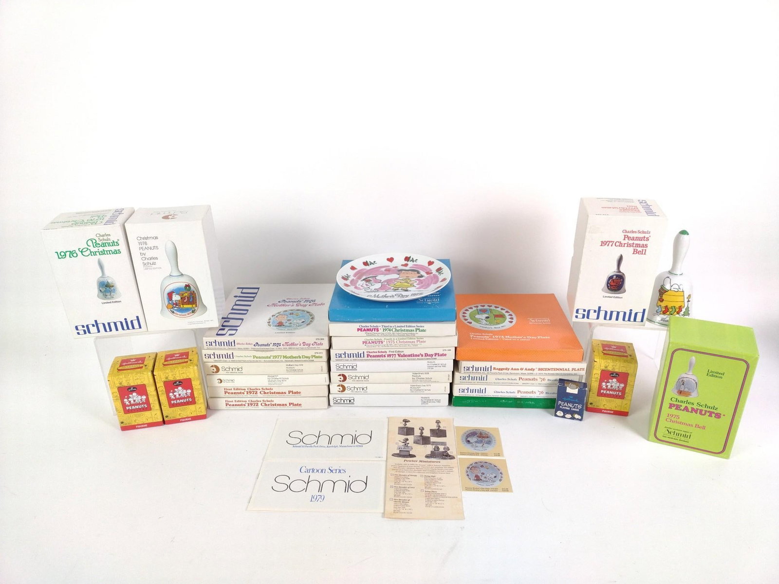 20 Vintage Snoopy Plates, 5 Snoopy Bells & 3 Pewter Snoopy Statues: All in good condition. Bell boxes measures 7" high.