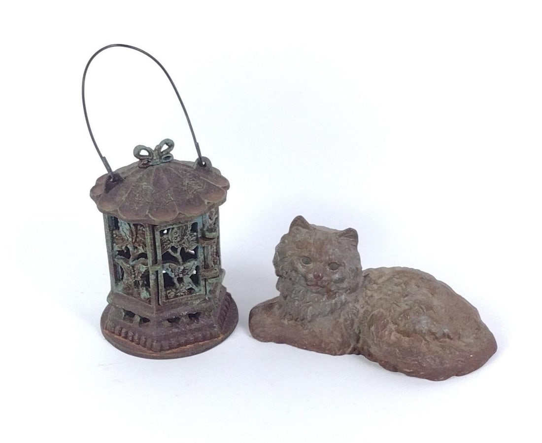 Hubley Persian Cat Door Stop & Cast Iron Bird Cage: In fair condition, experiences some wear and tear. Bird cage is ~8-3/4" tall; cat is ~9" long.