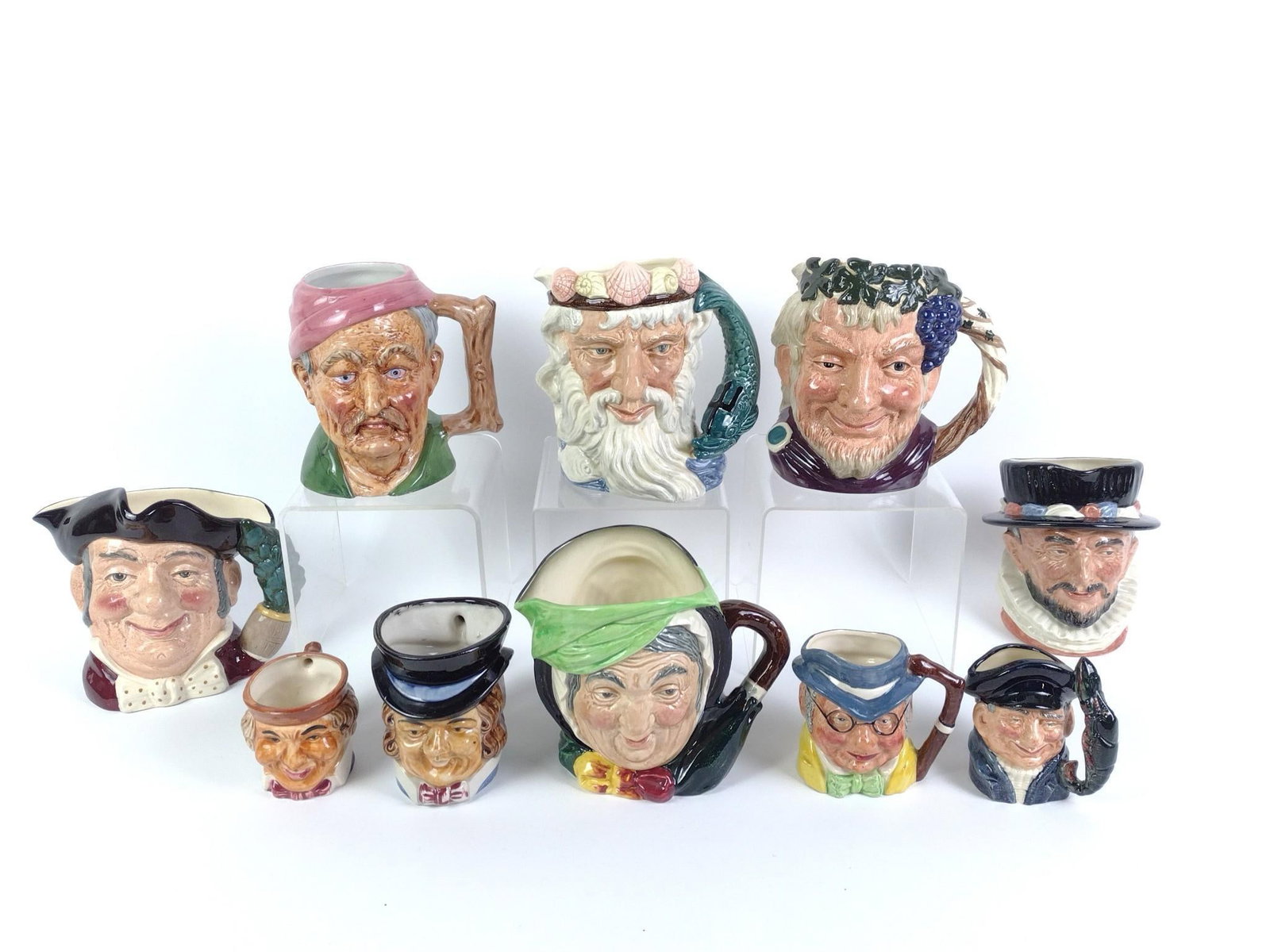 10 Royal Doulton Character and Toby Mugs: 3-1/4" to 8" wide x 4-1/2" to 7-1/4" high. 
