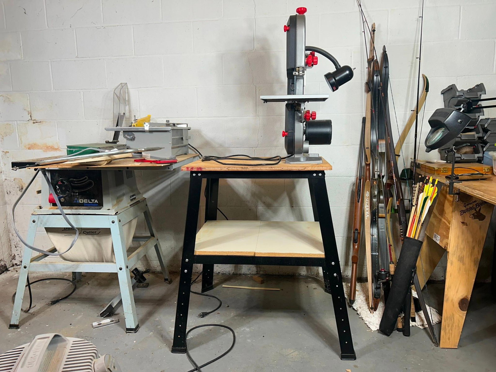 Task Force 9-Inch Band Saw: IMPORTANT NOTE. To be picked up in Carlisle, located in basement. 9-inch benchtop band saw, connected to wooden bench. Model BS2302W. Measures 34" x 28" x 63-1/2".