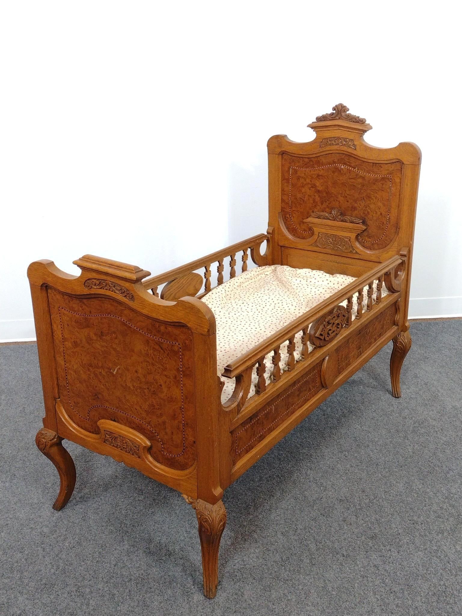 Victorian Inlaid Crib or Child's Bed: 24" wide X 45" deep X 40" high. Has a few spots of veneer loss. 